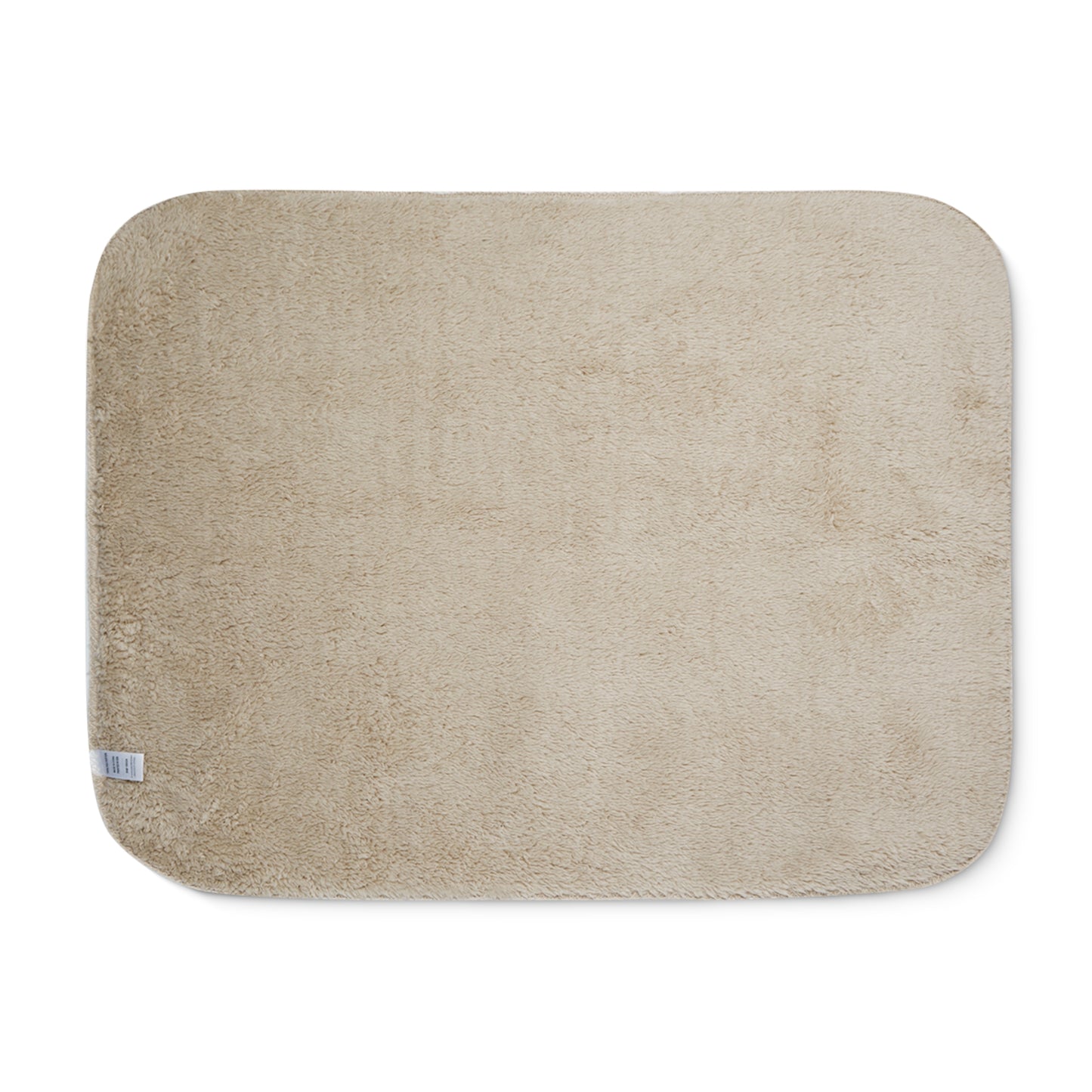 Beige bath mat on a white background