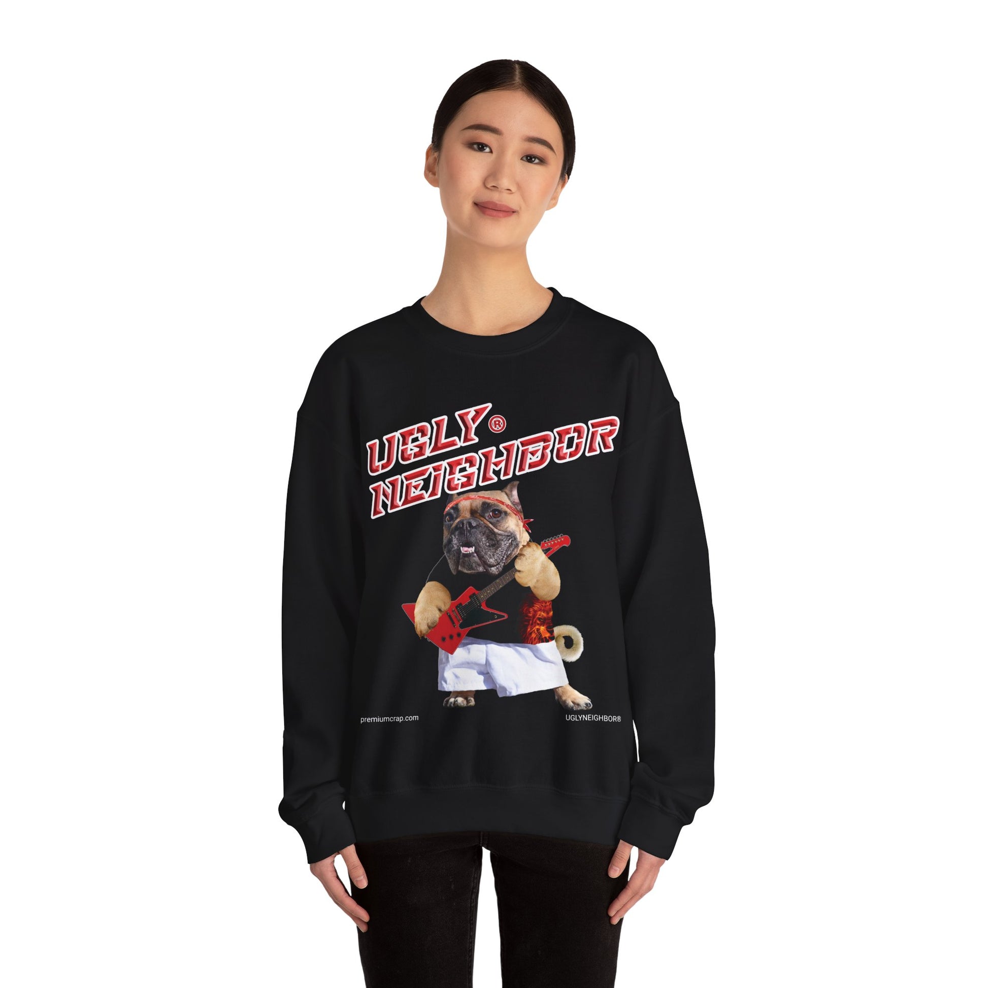 Person wearing a black sweatshirt with a graphic design of a pug and text on a white background
