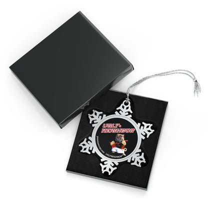 Decorative snowflake ornament with butterfly design on a black card, open black box in the background.