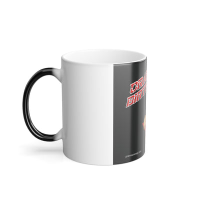 A ceramic mug with a white exterior, a black handle, and a dark gray vertical graphic panel on the side featuring red stylized text and a small flame icon.