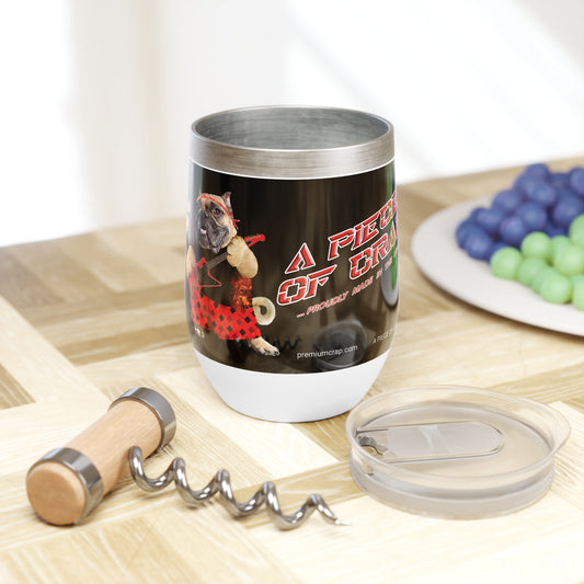 Tumbler with graphic design on a wooden table with grapes and a corkscrew.