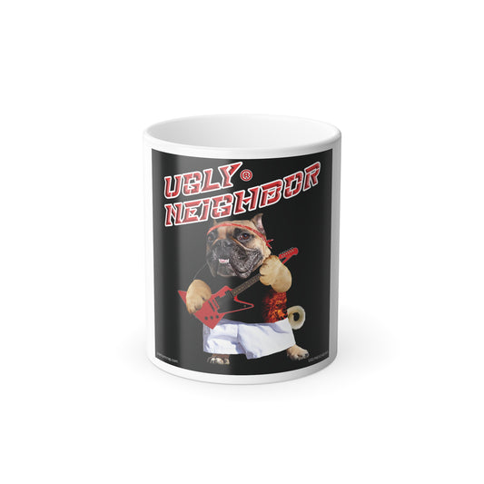 A white ceramic mug featuring a black graphic print of a pug dressed as a rock star with the text 'UGLY NEIGHBOR' in red and white, set against a plain white background.