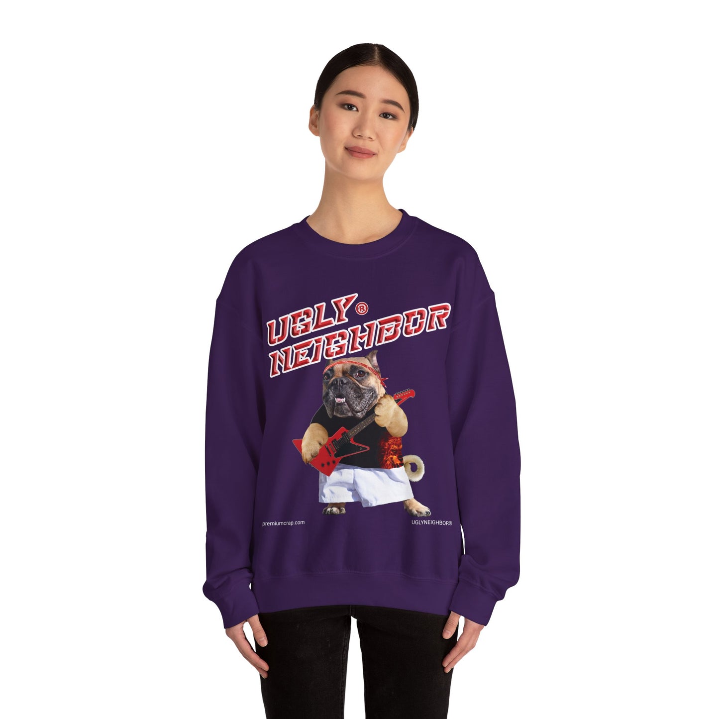 Person wearing a purple sweatshirt with a graphic of a pug and text on a white background