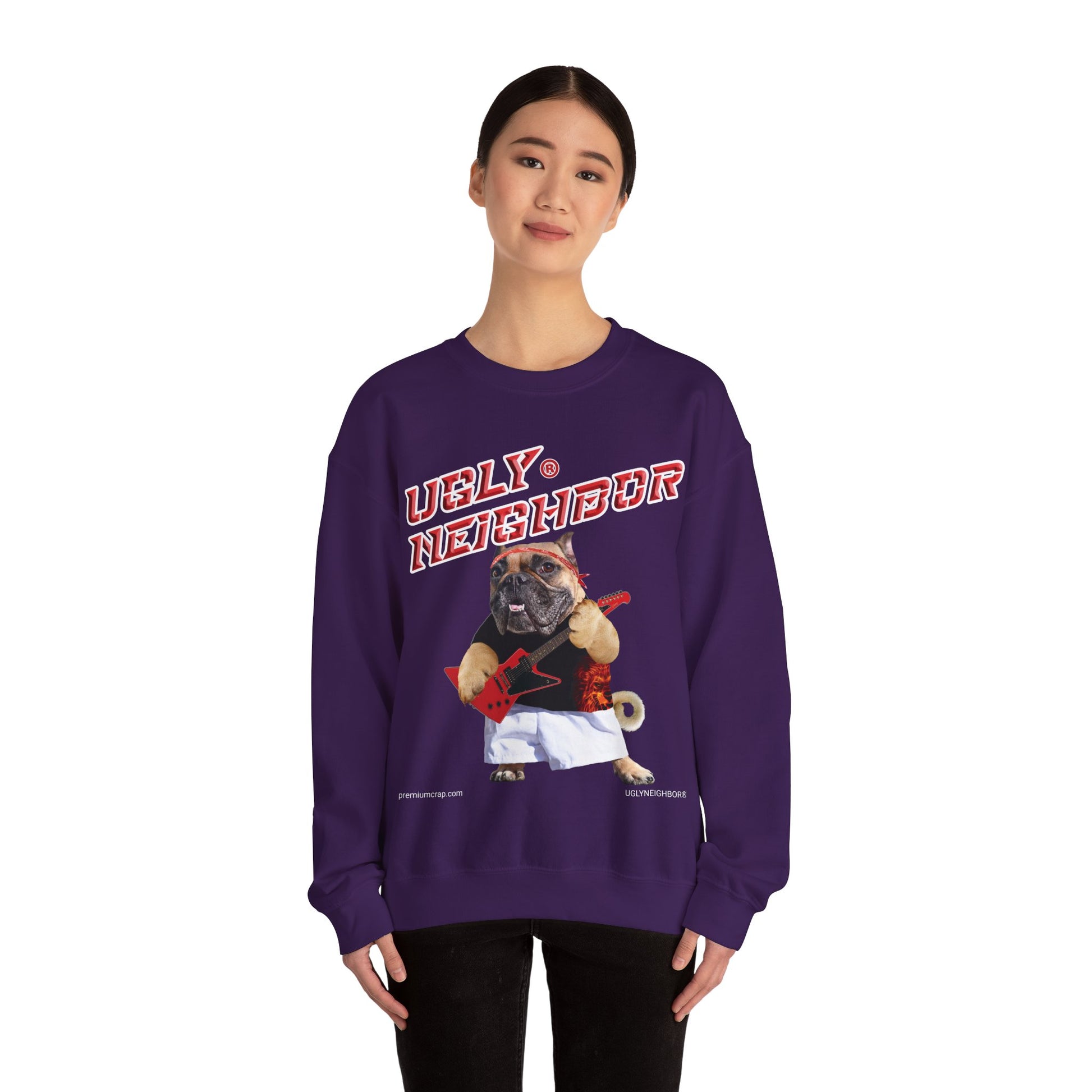 Person wearing a purple sweatshirt with a graphic of a pug and text on a white background