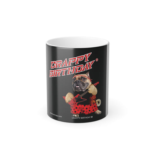 A black ceramic mug with a white interior, featuring a humorous graphic of a bulldog wearing a red polka-dot outfit and holding a guitar.