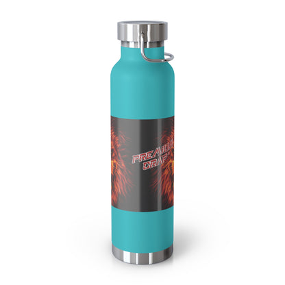 A teal insulated water bottle with a black wrap-around graphic featuring red and orange flames and the text 'Premium Crap'. The bottle has a silver stainless steel cap and base with a carrying loop.