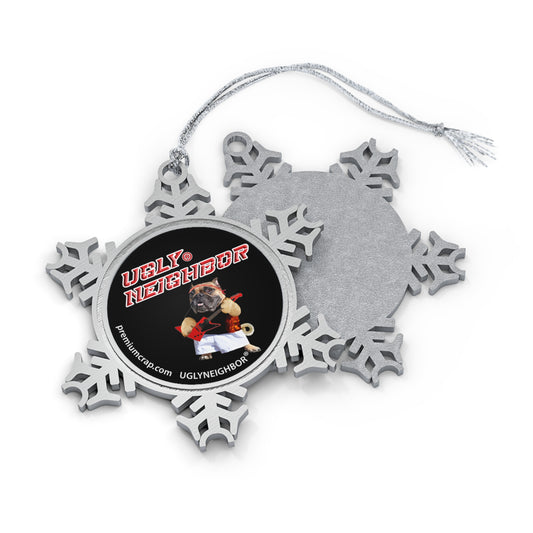 A silver snowflake-shaped hanging ornament shown front and back on a white background. The front features a circular black insert with red text reading 'Ugly Neighbor' and a small dog photo, with a silver hanging string above.