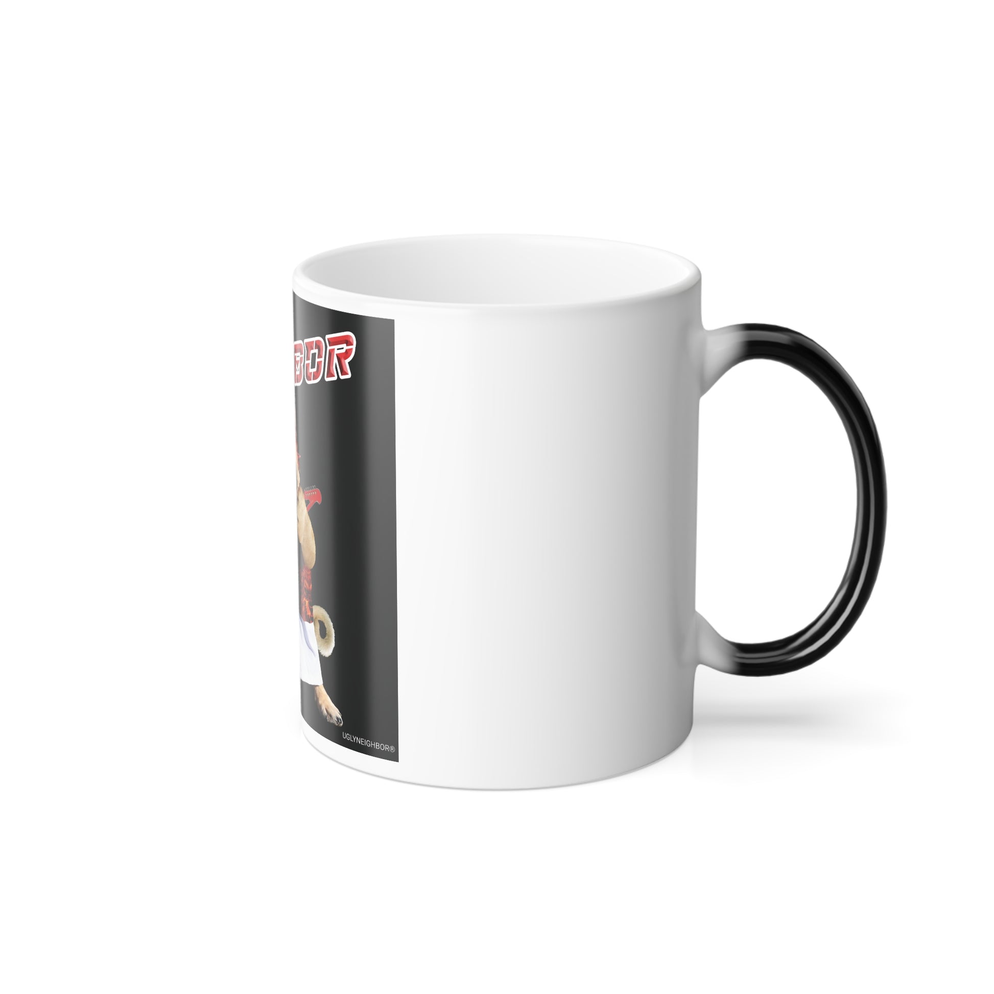 A white ceramic mug with a black handle, featuring a printed graphic on the side with a cartoon character and partial red text, shown on a clean white background.