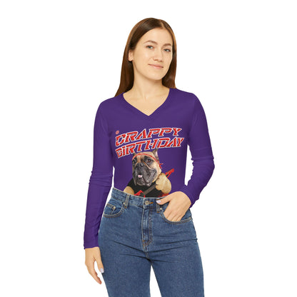 Woman wearing a purple long-sleeve shirt with a graphic design on a white background