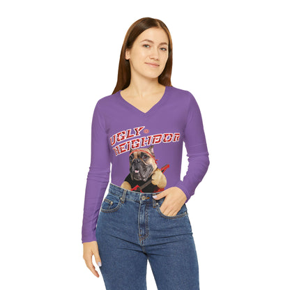 Woman wearing a purple long-sleeve shirt with a graphic design on a white background