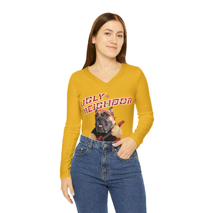 Woman wearing a mustard yellow long-sleeve shirt with a graphic design on a white background