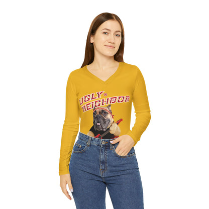 Woman wearing a mustard yellow long-sleeve shirt with a graphic design on a white background